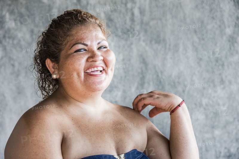 Close up of laughing Hispanic woman
