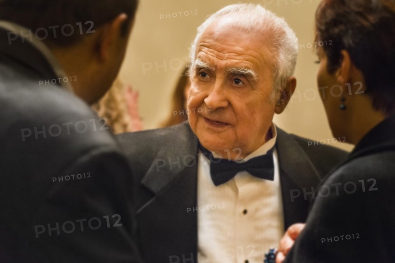 Close up of older man talking to friends