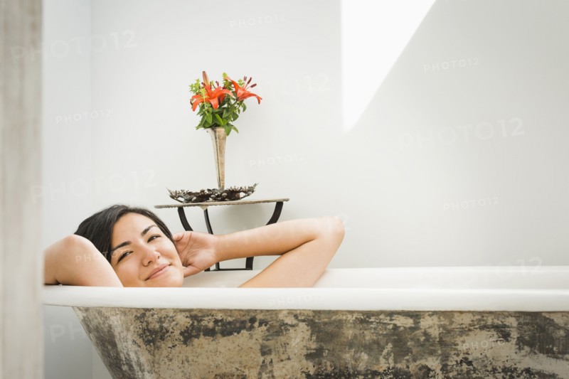 Woman relaxing in bubble bath