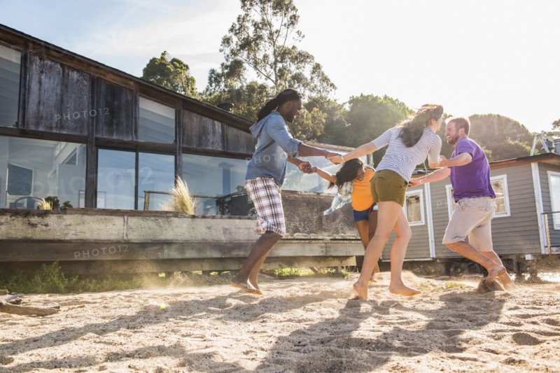 Friends playing in sand