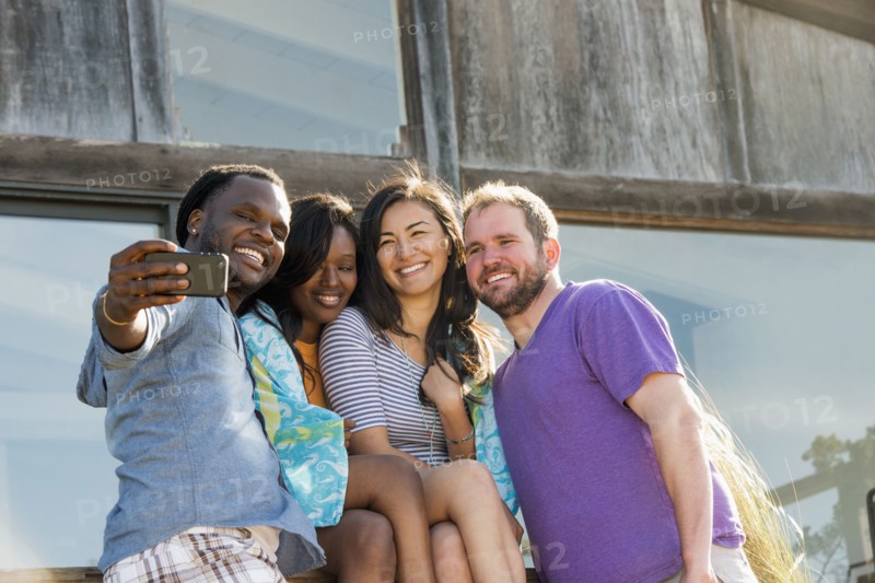 Friends taking selfie outdoors