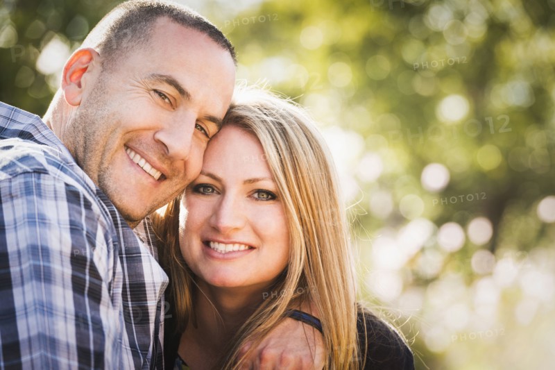 Smiling couple hugging outdoors