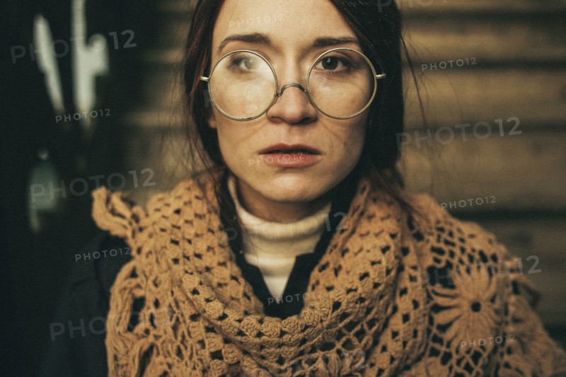 Caucasian woman wearing scarf and eyeglasses