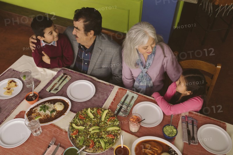 High angle view of grandparents and grandchildren in restaurant
