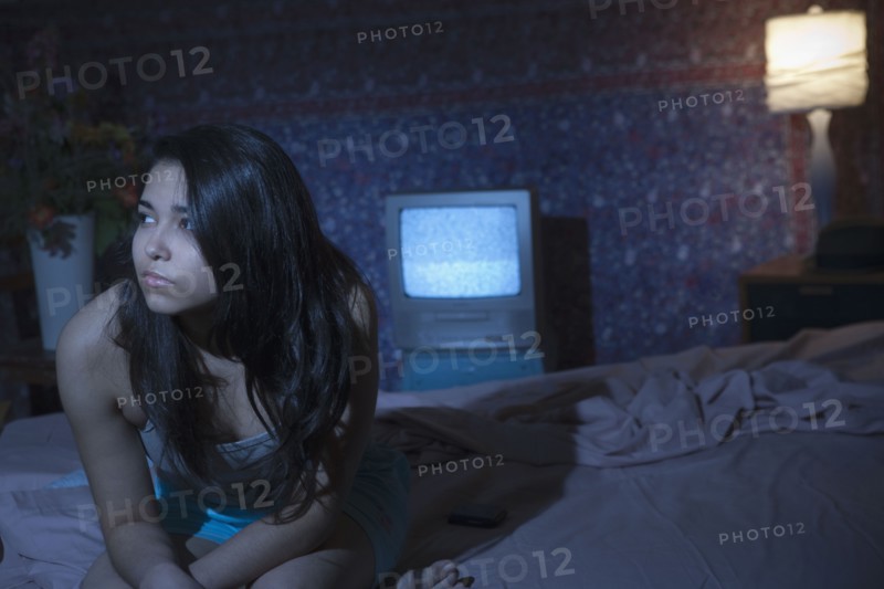 Hispanic woman having trouble sleeping