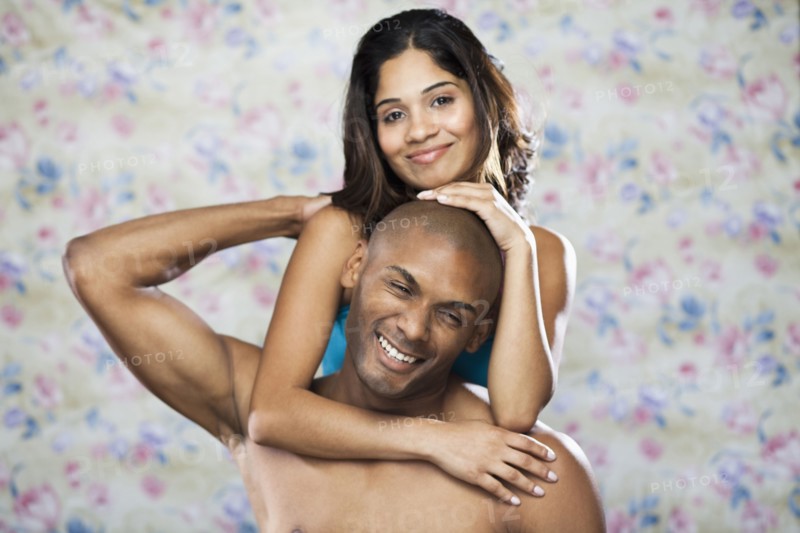 Playful couple hugging
