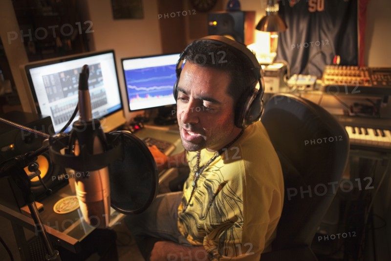 Caucasian man working in music studio