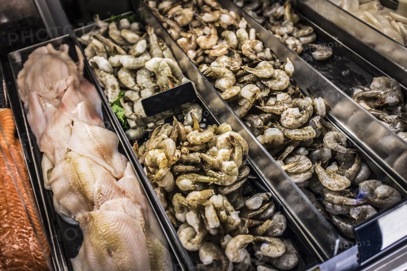 Shrimp and fish fillets in display case