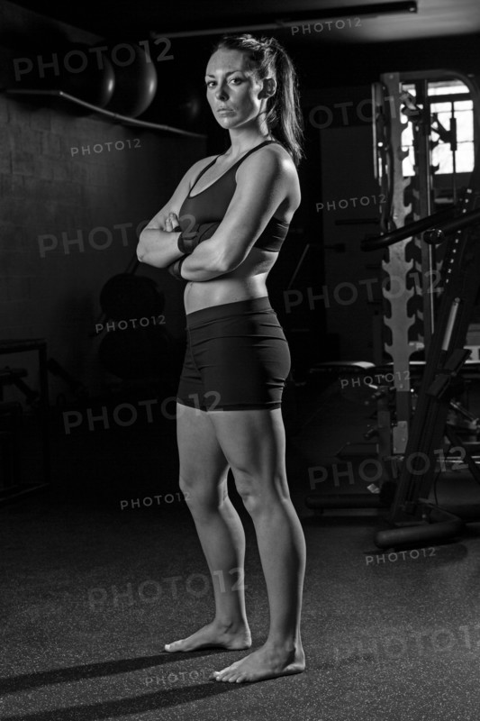 Caucasian fighter standing in gym