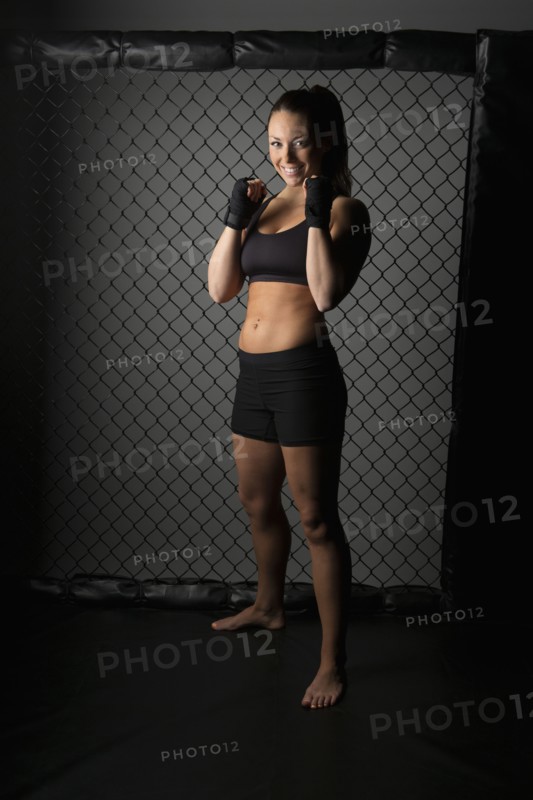Caucasian fighter standing in gym