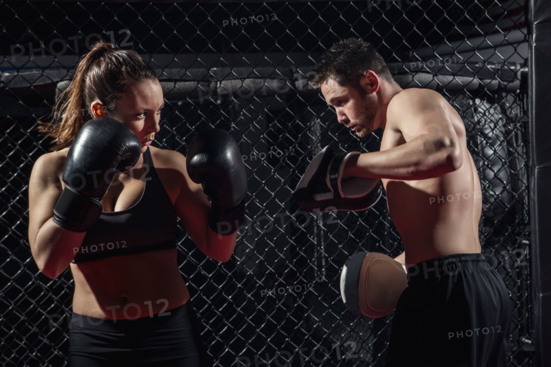 Caucasian fighters training in gym