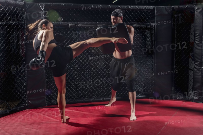 Caucasian fighters training in gym