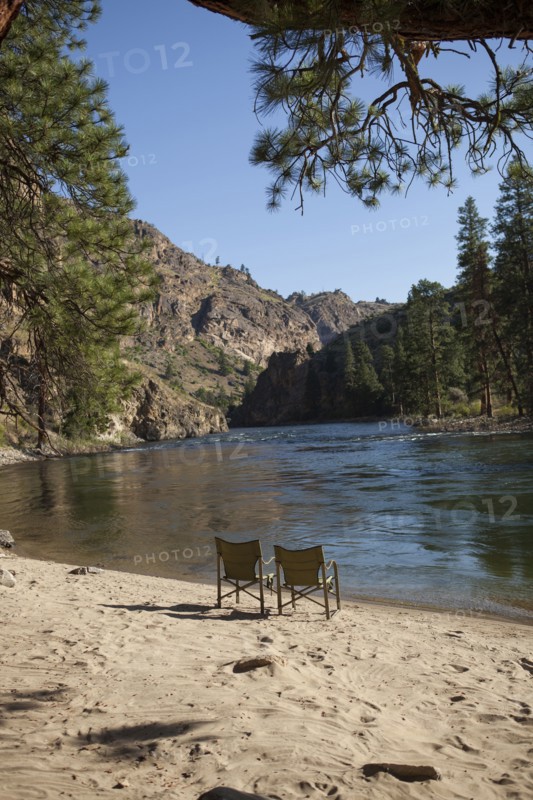 Two chairs on sandy remote beach