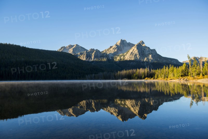 Mountain reflecting in still lake
