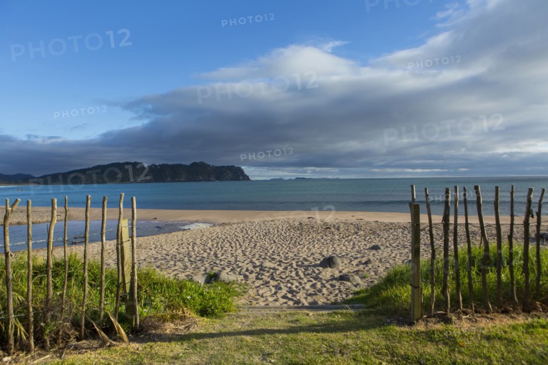 Wooden fence on remote beach