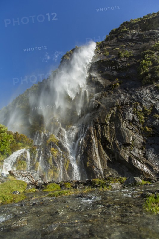 Waterfall pouring over remote cliff