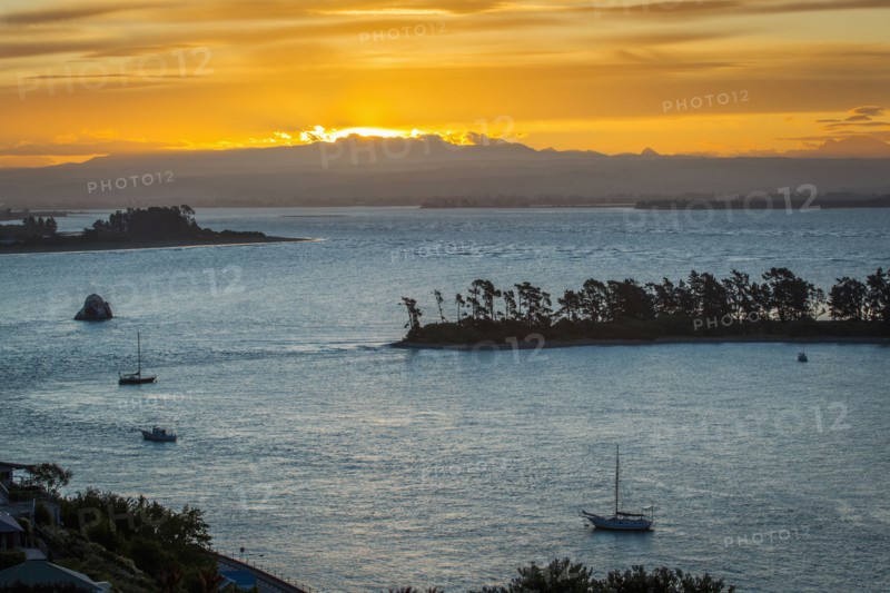 Aerial view of boats sailing near island sandbar