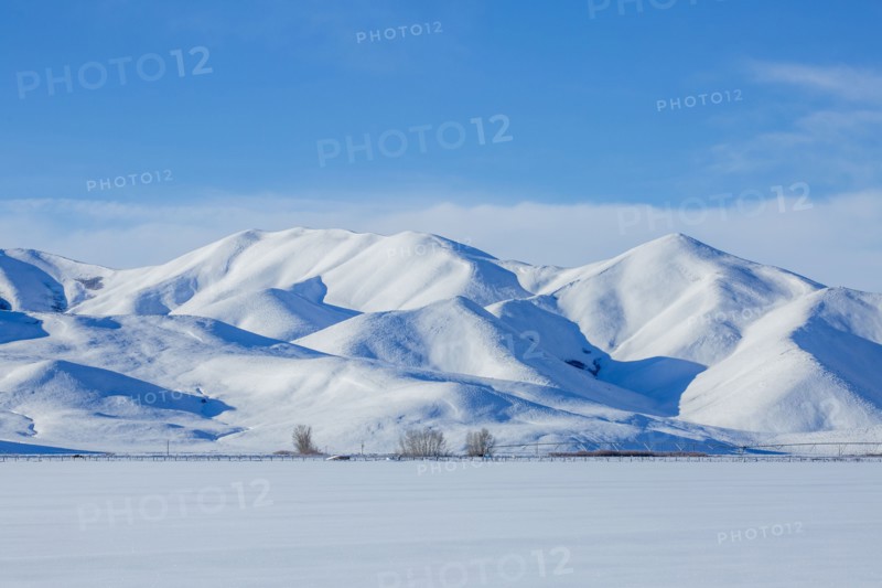 Snow covered hills in rural landscape