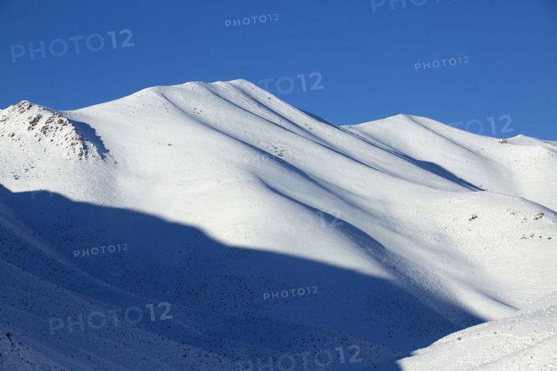 Snowy mountains in remote landscape