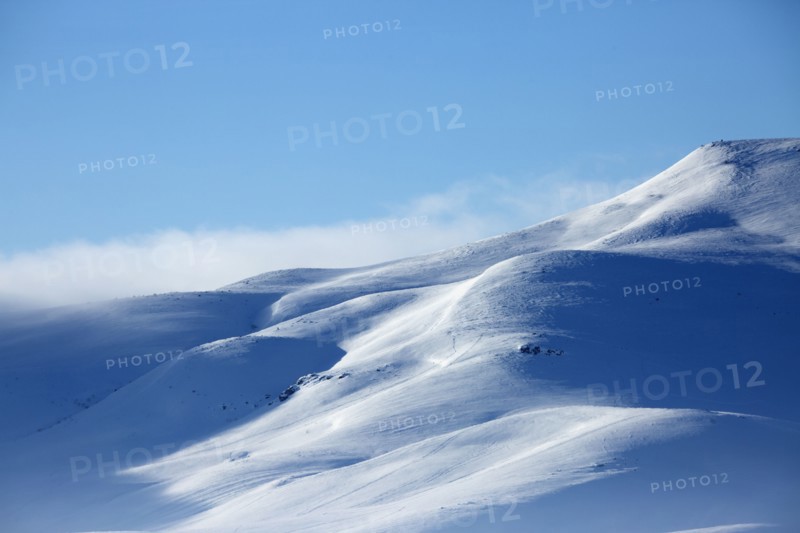 Snowy mountains in remote landscape