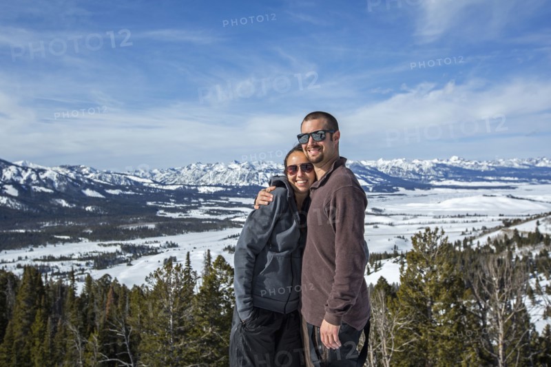 Caucasian couple smiling near remote landscape view
