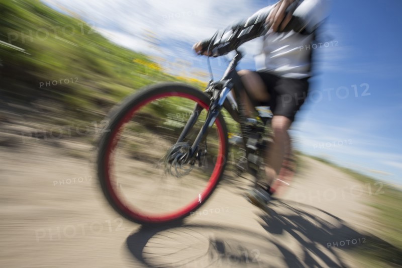 Blurred view of man riding mountain bike