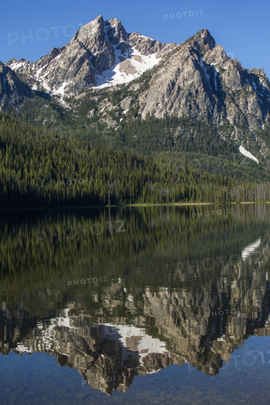 Reflection of mountain in still lake