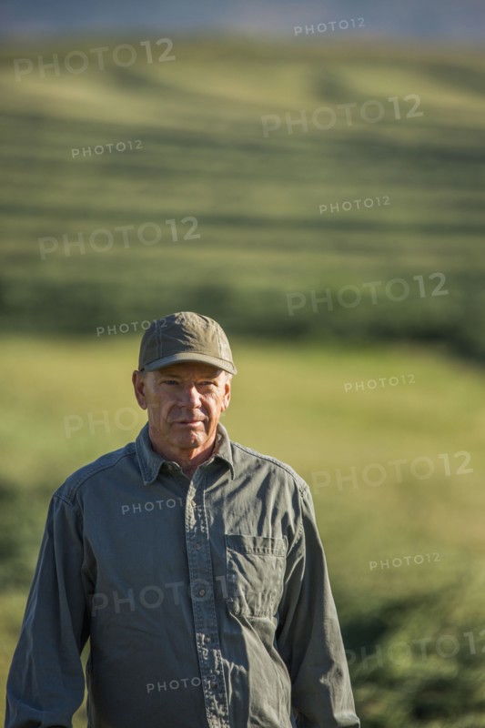 Caucasian farmer standing in field