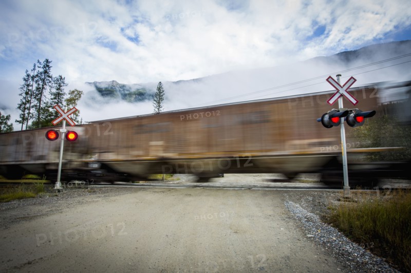 Train speeding through railroad crossing