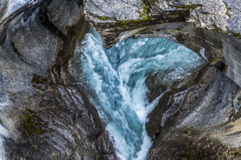 Rapids flowing under rocks