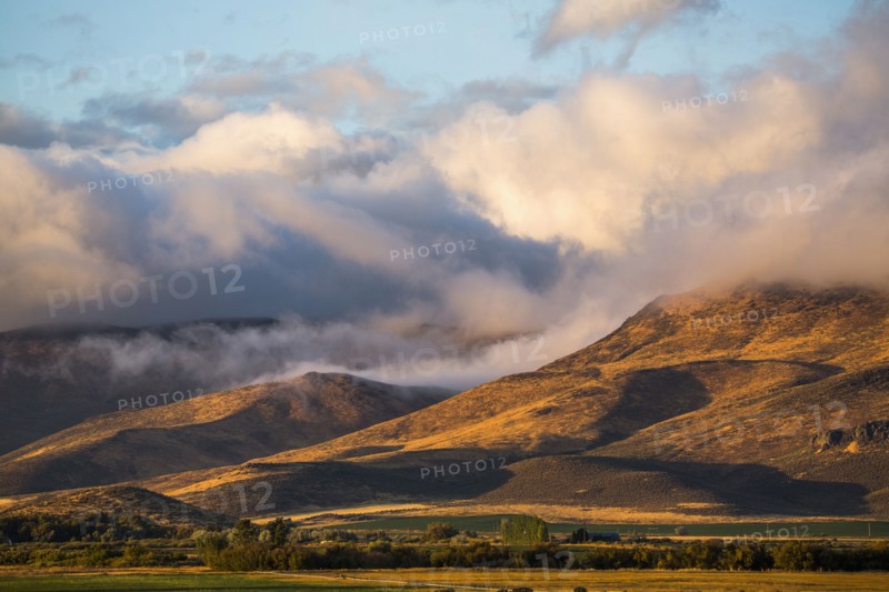 Clouds over mountain range