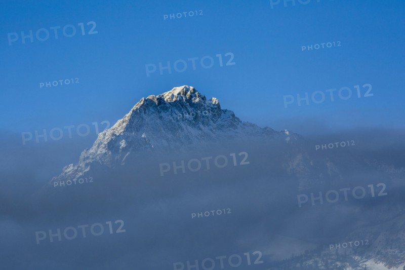 Mountain peak above clouds