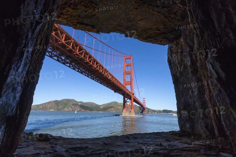 Rocks framing Golden Gate Bridge