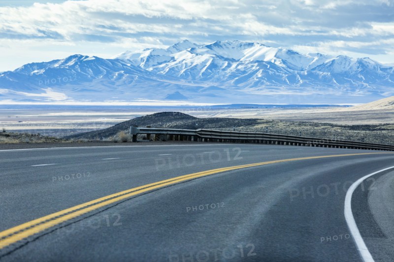 Curving street near mountain range