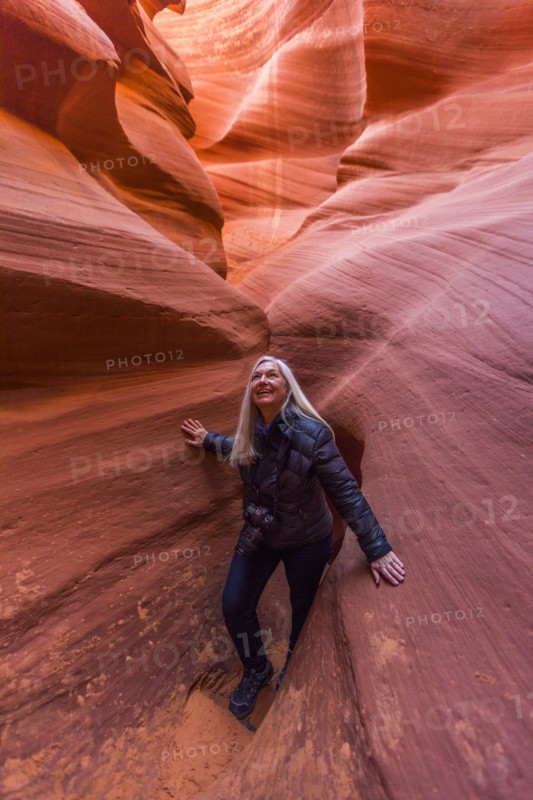 Caucasian woman walking in rock formation