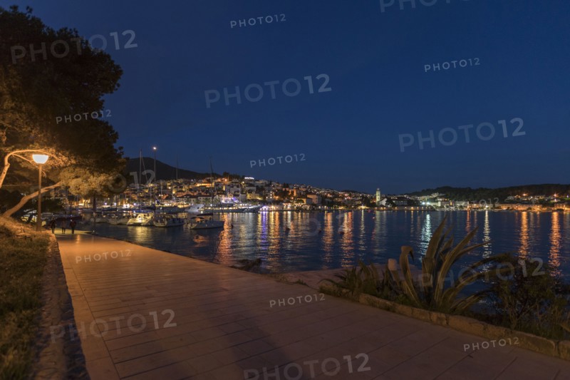 Scenic view of waterfront at night