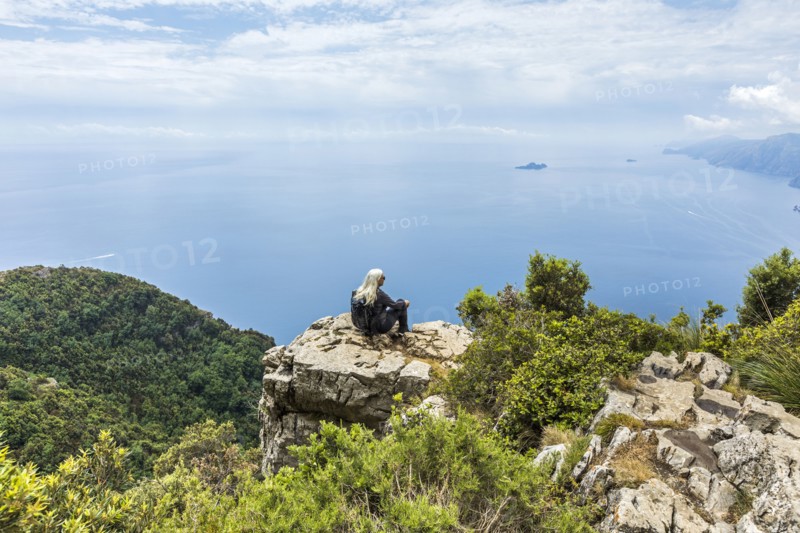 Caucasian woman admiring scenic view of ocean