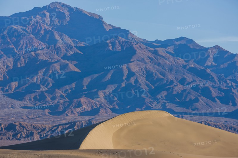 Sand dune near mountain landscape