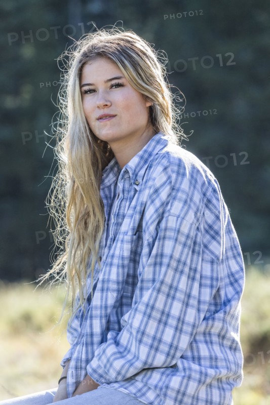 Portrait of smiling Caucasian girl wearing plaid shirt