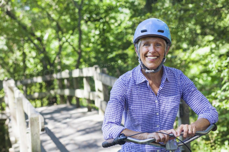 Portrait of Caucasian woman posing with bicycle