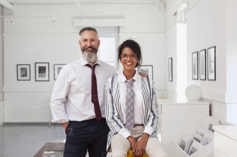Portrait of smiling businessman and businesswoman