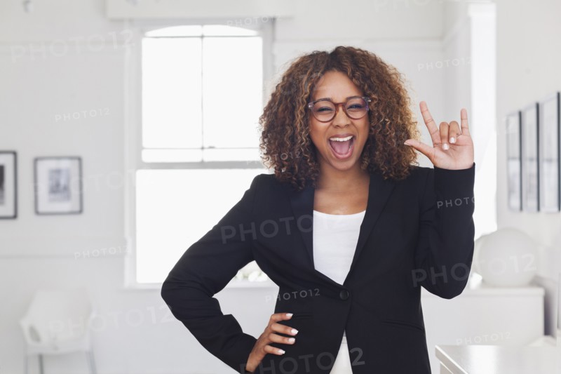Mixed race woman gesturing in gallery