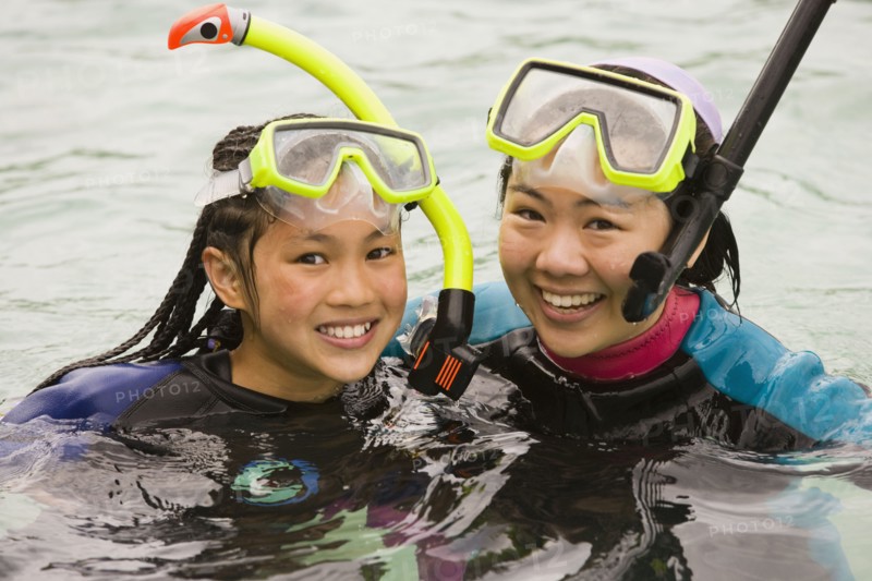 Friends snorkeling together