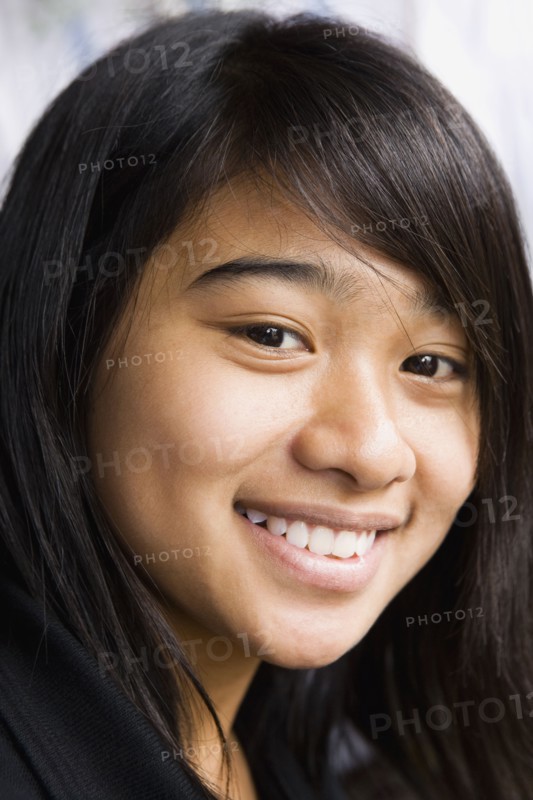 Asian teenage girl smiling