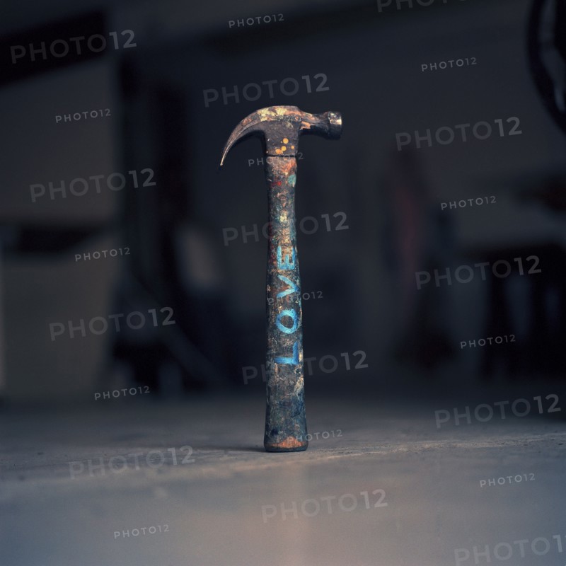 Dirty hammer with the word 'love' written on it
