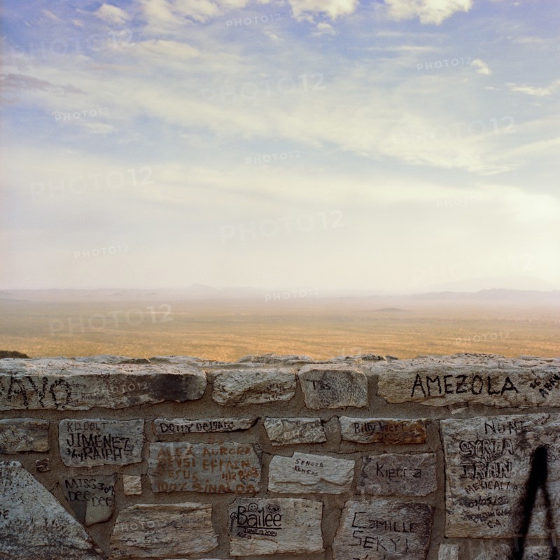 Graffiti on wall with desert in background