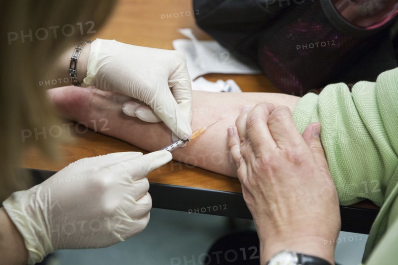Close up of nurse giving patient injection