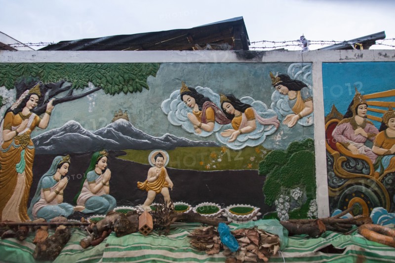 Mural of Buddhist figures painted on wall