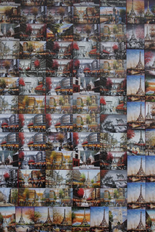 Collage of souvenir postcards on gift shop wall