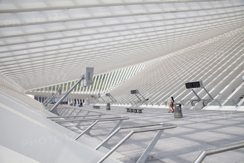 Couple walking in modern train station